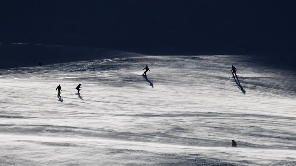 Snowboarder and Skiing at Mount Hutt